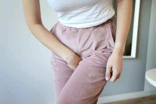 woman struggling with urine incontinence Ashford