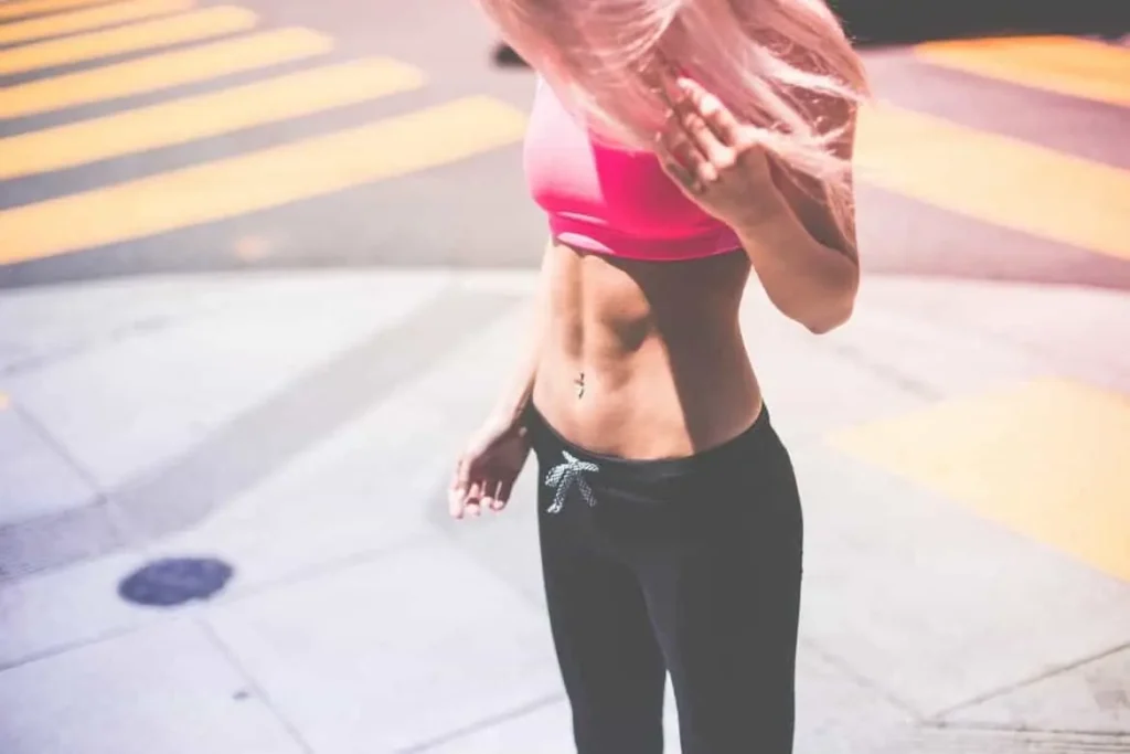 Woman with toned stomach after LA-EMS Body Sculpting Treatment Ashford 